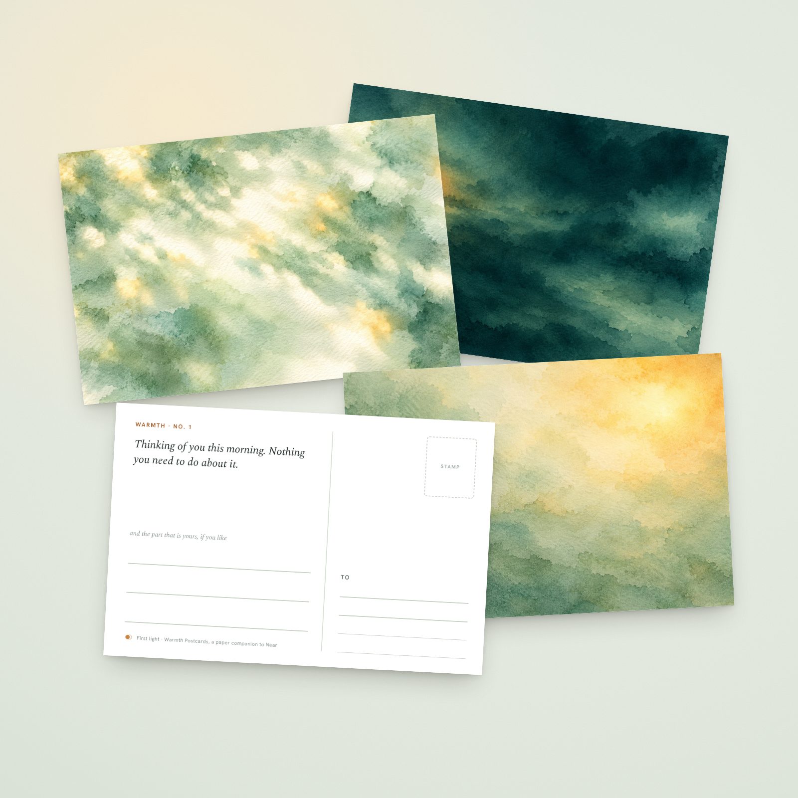 Warmth Postcards printed and fanned out